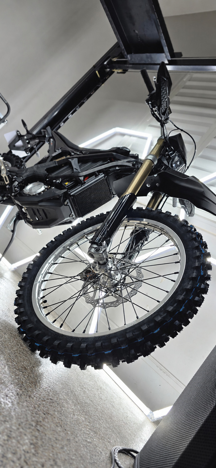 Low-angle view of a black electric dirt bike