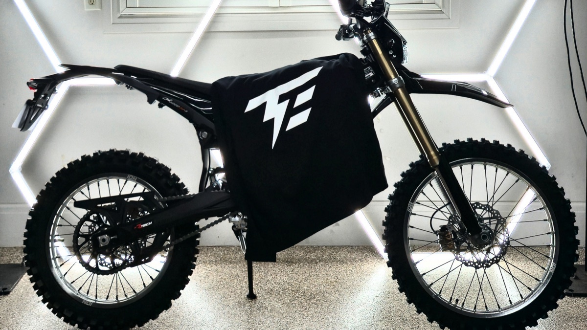 Black Tuff Emoto shirt displayed on an electric dirt bike